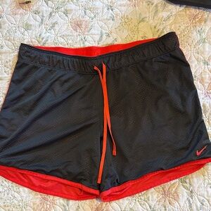 Nike Women's Black and Orange Athletic Shorts